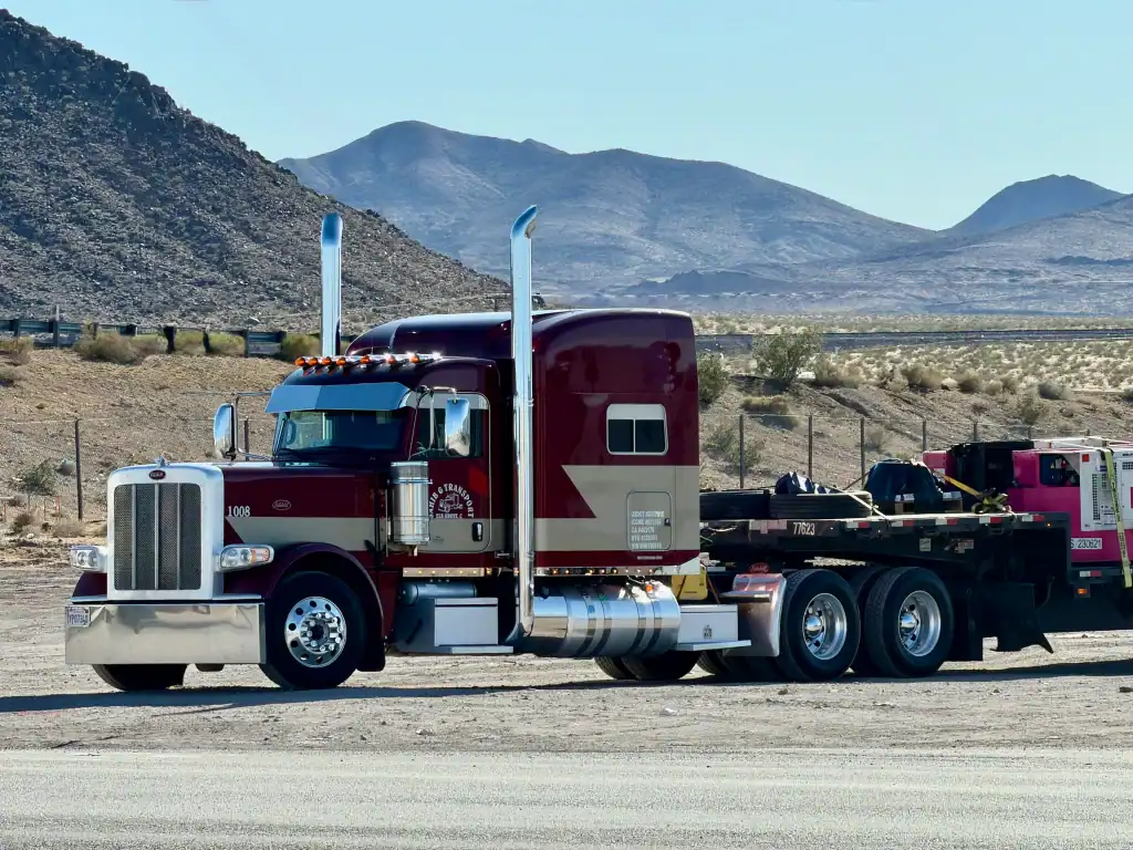 Maroon semi-truck parked roadside in Riverside County, CA