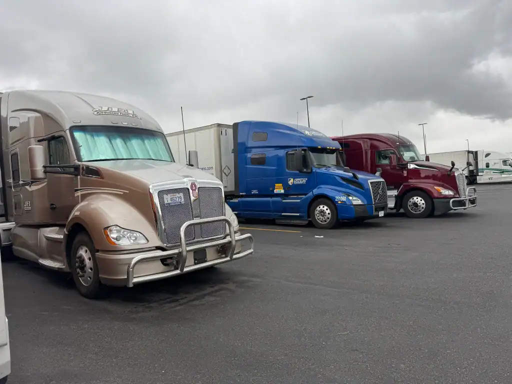 Three semi-trucks parked before fleet Clean Truck Check testing